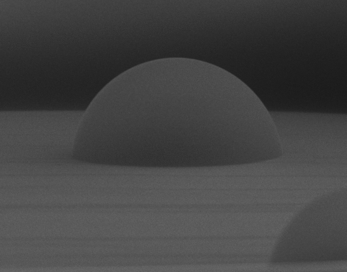 A magnified scanning electron microscope image of a single microlens developed by MNS